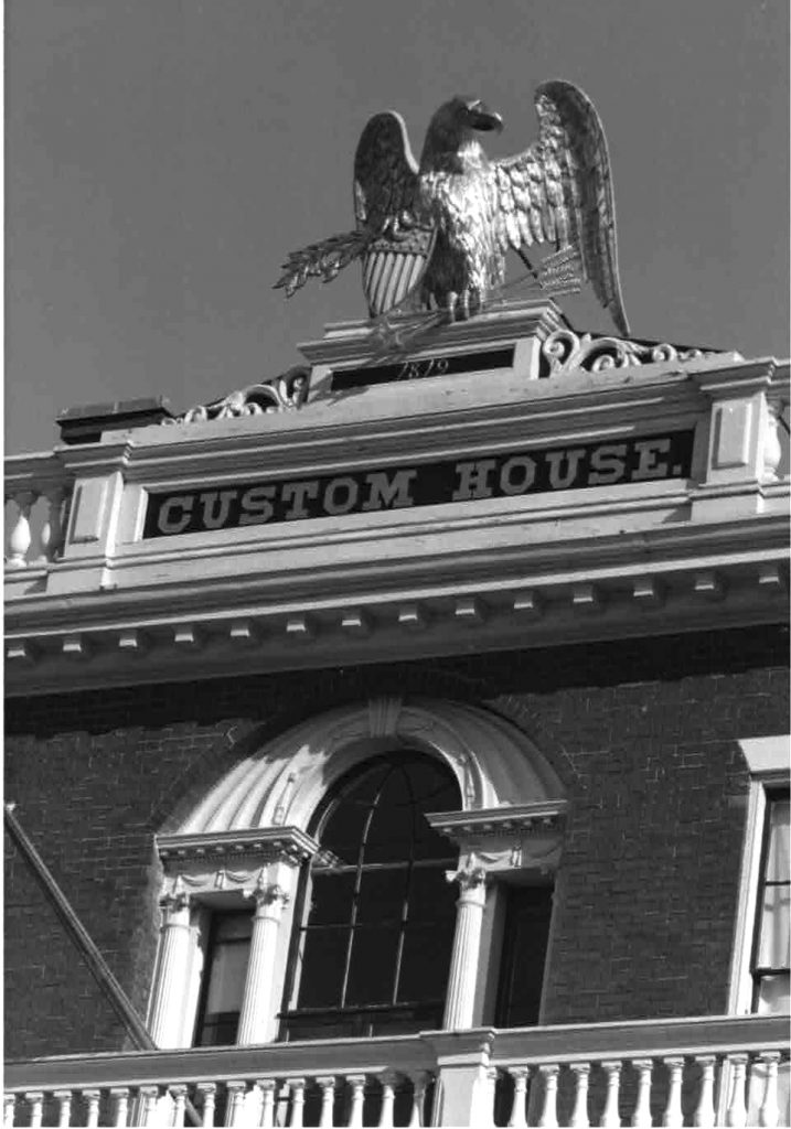 Black & White PhotographDetail of the Custom House in Salem. Representing the presence of the Federal Government in Salem, this building was designed to impart feelings of strength and stability. It was built in 1819; a wooden eagle was added on the roof in 1826. The original wooden eagle is on display inside; a fiberglass replica now sits on the roof.